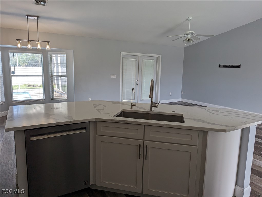 2311 Southwest 16th Terrace Cape Coral, FL 33991 - Photo 10 of 23 a kitchen with a sink and cabinets