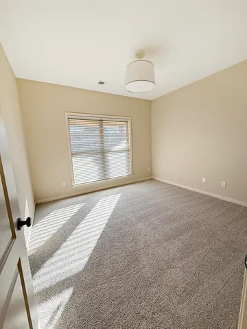 a bathroom with a granite countertop toilet a sink and a bathtub
