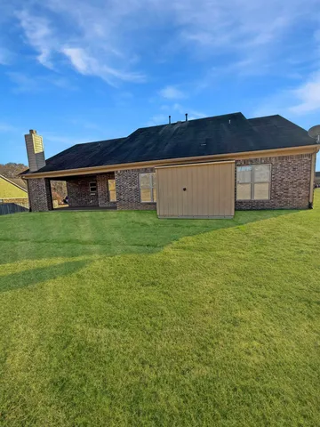 a view of a yard with an outdoor space