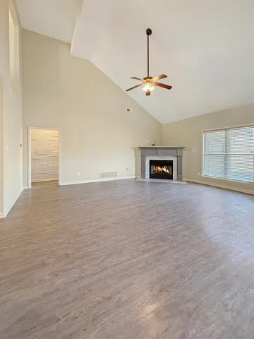 a view of an empty room with a window