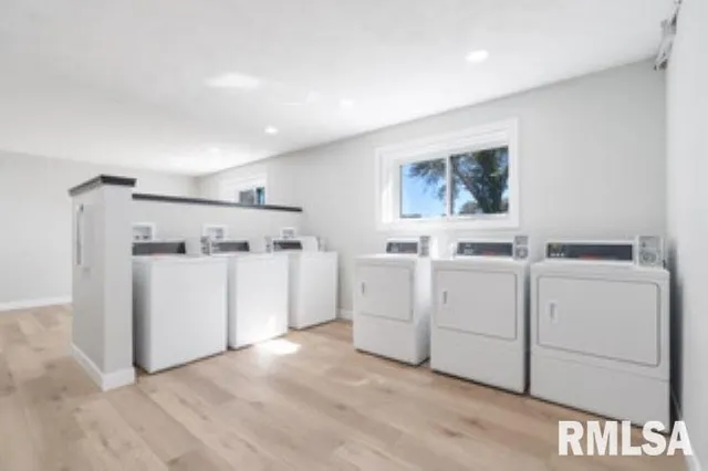 a view of storage and utility room with washer and dryer