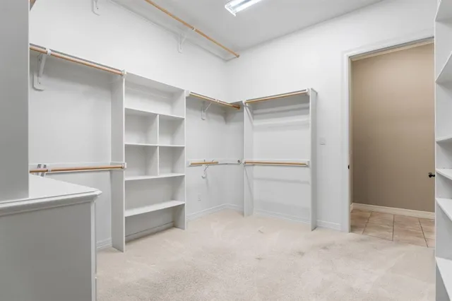 a utility room with sink dryer and washer