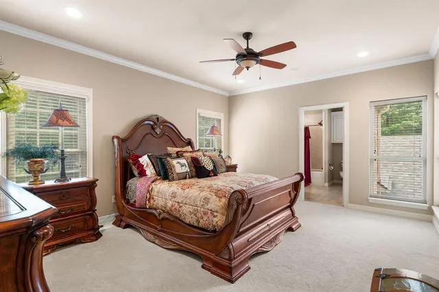 a en suite bathroom with a double vanity sink a mirror and a shower