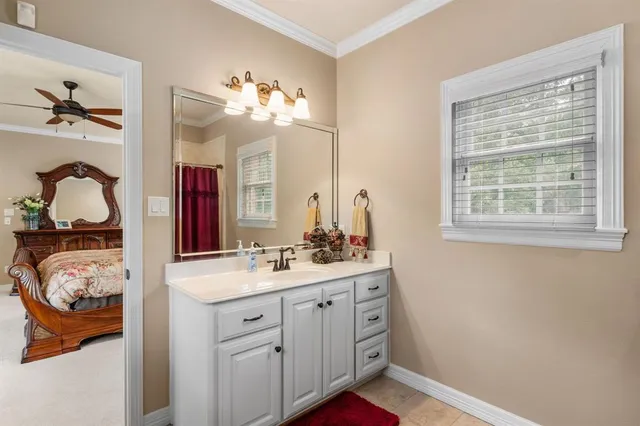 a bedroom with a bed and a table