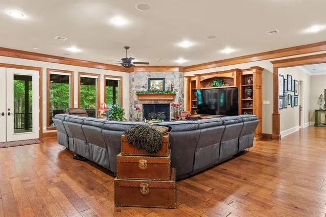 a living room with furniture fireplace and flat screen tv