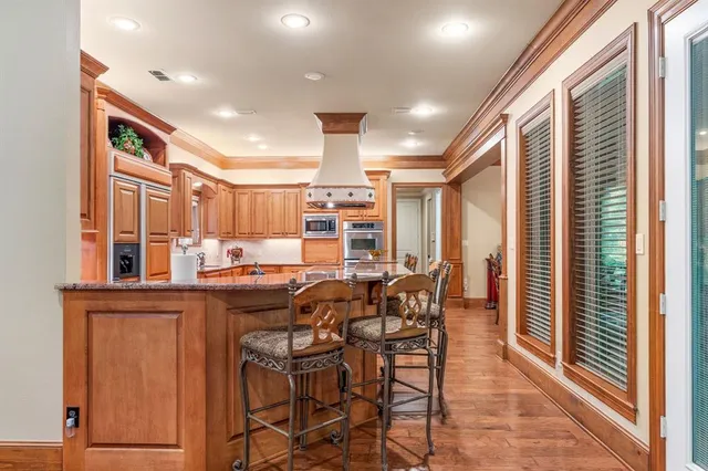 a view of a dining room with furniture and window