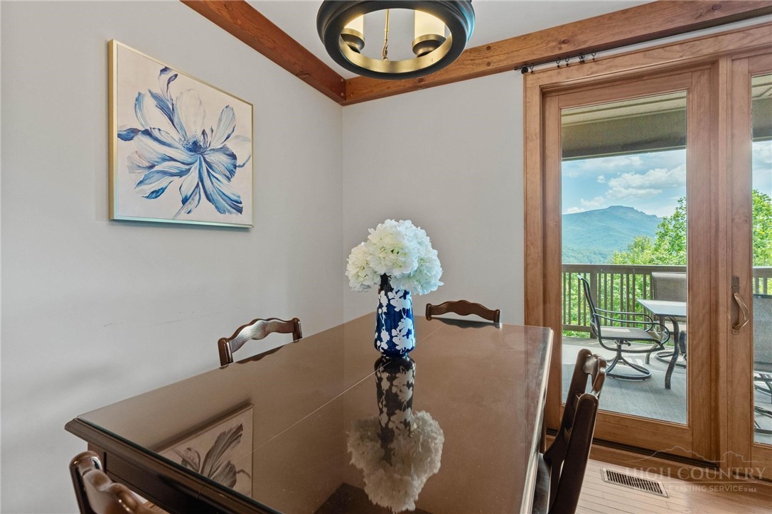 142 Evening View Lane, Unit CA3 Boone, NC 28607 - Photo 13 of 41 a view of a dining room with a table and chairs