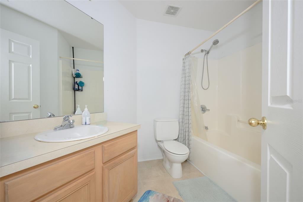 11 Riddle Drive Palm Coast, FL 32164 - Photo 18 of 33 a bathroom with a sink a toilet and shower