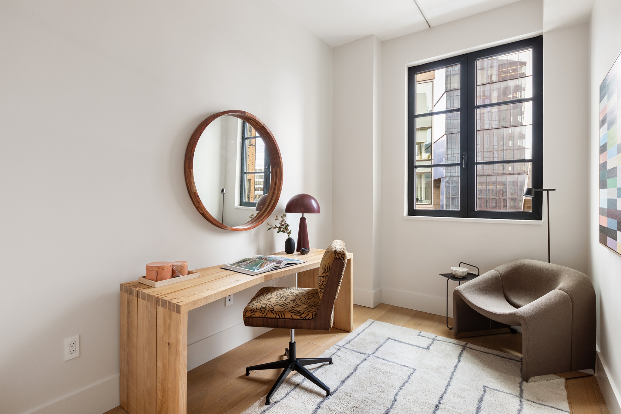 517 West 29th Street, Unit 5H Manhattan, NY 10001 - Photo 4 of 16 a workspace with furniture and a window