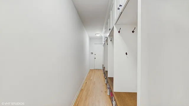a view of a hallway with a white door