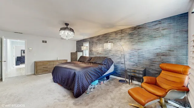 a bedroom with a bed and ceiling fan