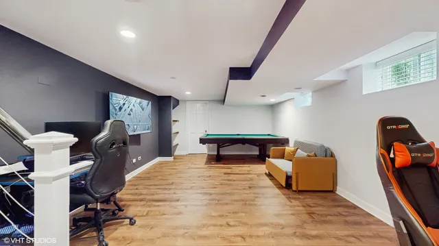 a bedroom with furniture and a chair