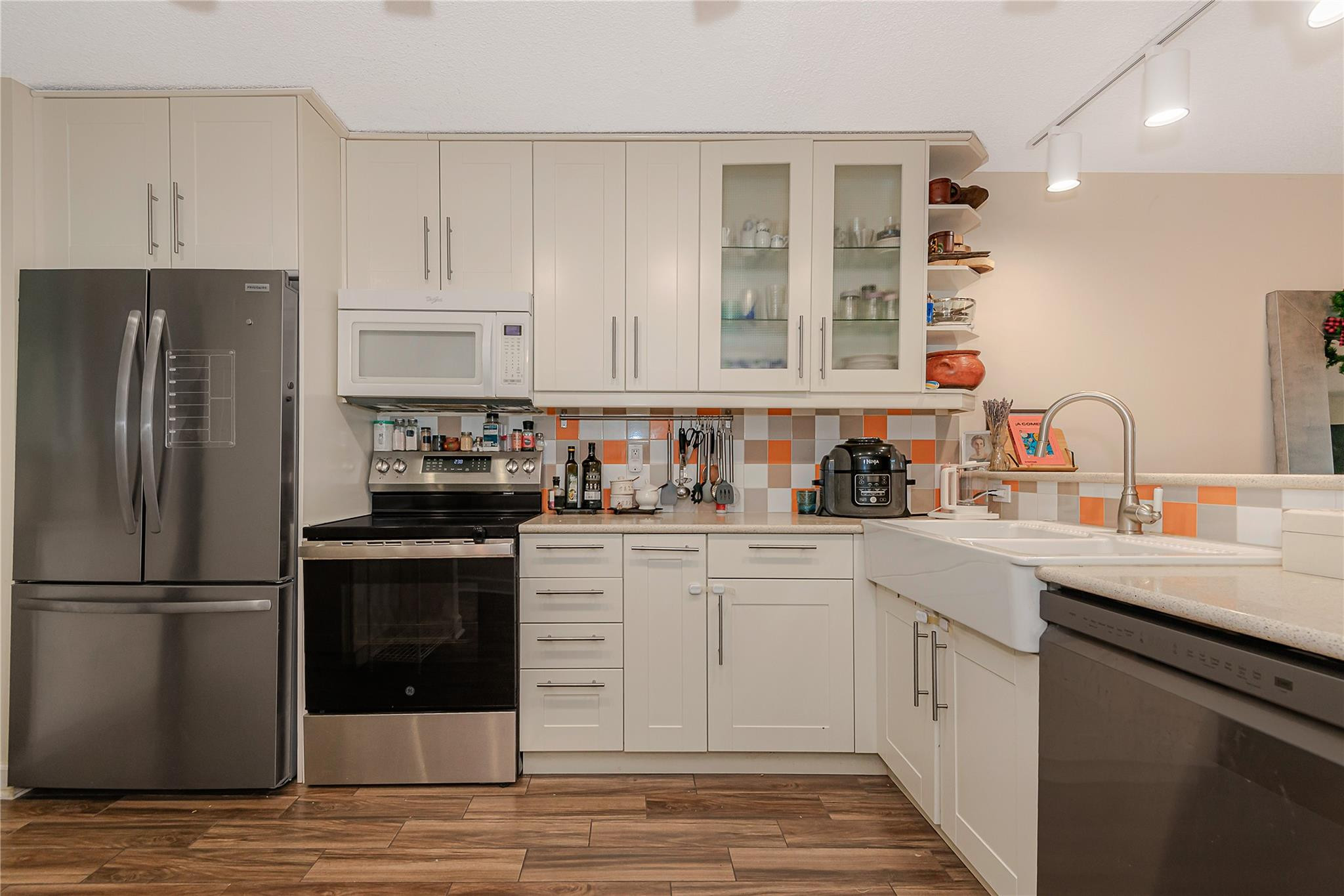 5300 Northeast 24th Terrace, Unit 512 Fort Lauderdale, FL 33308 - Photo 1 of 35 a kitchen with a sink cabinets stainless steel appliances and a window
