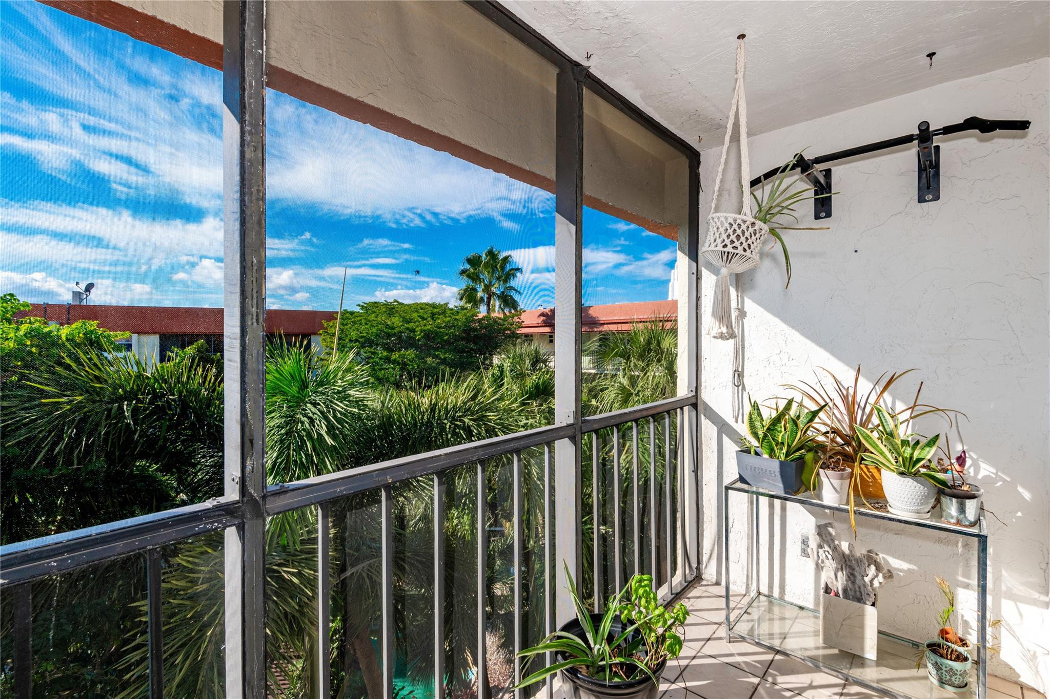 5300 Northeast 24th Terrace, Unit 512 Fort Lauderdale, FL 33308 - Photo 21 of 35 a view of a balcony with potted plants