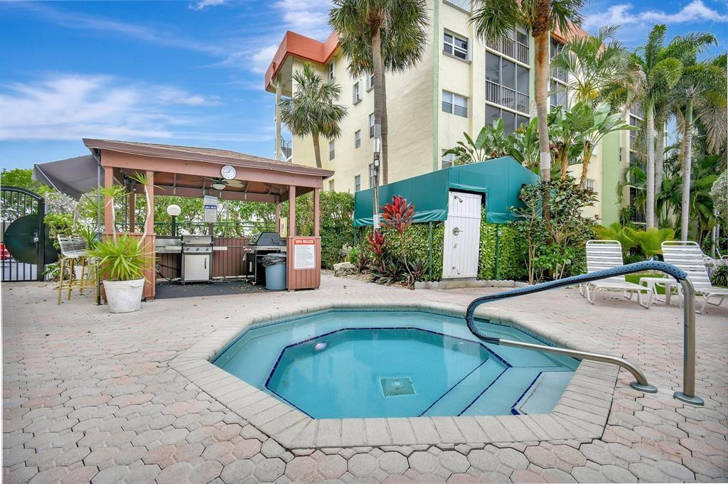5300 Northeast 24th Terrace, Unit 512 Fort Lauderdale, FL 33308 - Photo 22 of 35 a view of a backyard with sitting area and furniture