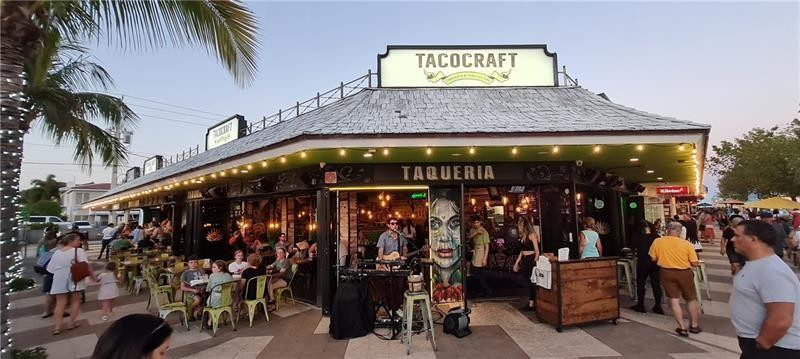 5300 Northeast 24th Terrace, Unit 512 Fort Lauderdale, FL 33308 - Photo 24 of 35 a view of people sitting in front of retail shop
