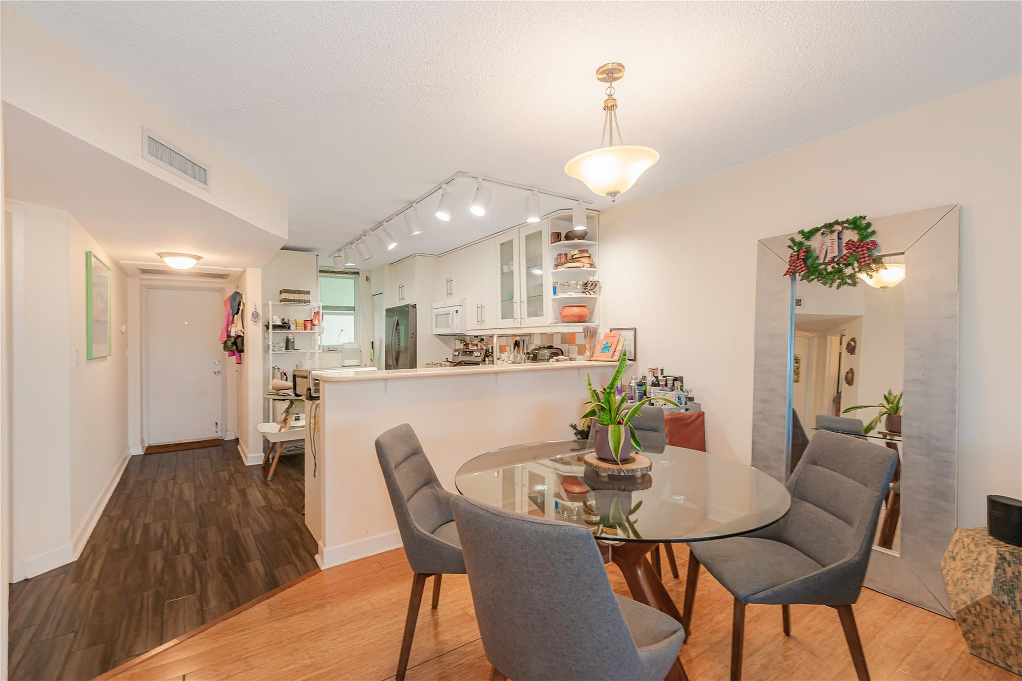 5300 Northeast 24th Terrace, Unit 512 Fort Lauderdale, FL 33308 - Photo 3 of 35 a view of a dining room with furniture and wooden floor