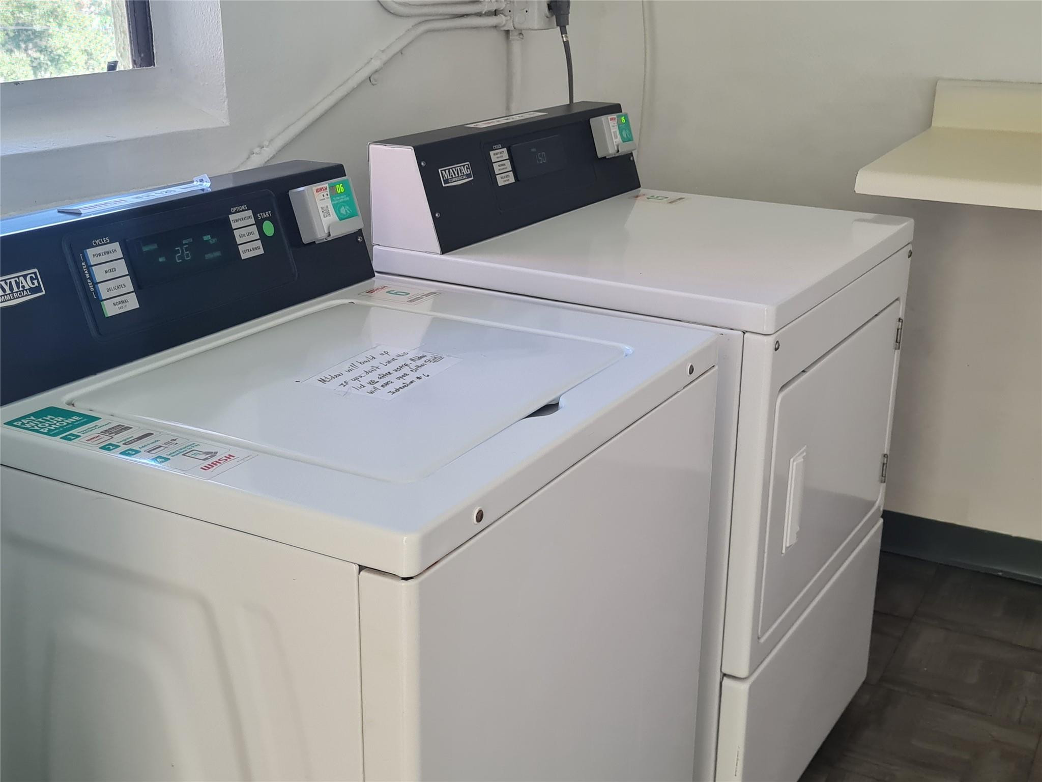 5300 Northeast 24th Terrace, Unit 512 Fort Lauderdale, FL 33308 - Photo 33 of 35 a utility room with dryer and washer