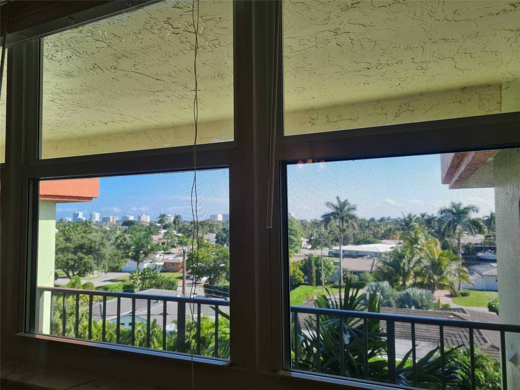 5300 Northeast 24th Terrace, Unit 512 Fort Lauderdale, FL 33308 - Photo 35 of 35 a view of a glass door with a from a window