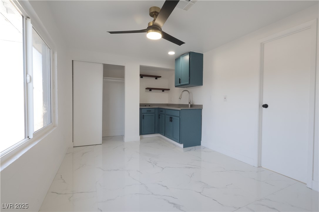 3115 Wright Avenue North Las Vegas, NV 89030 - Photo 12 of 20 Studio Kitchen/living featuring ceiling fan, blue