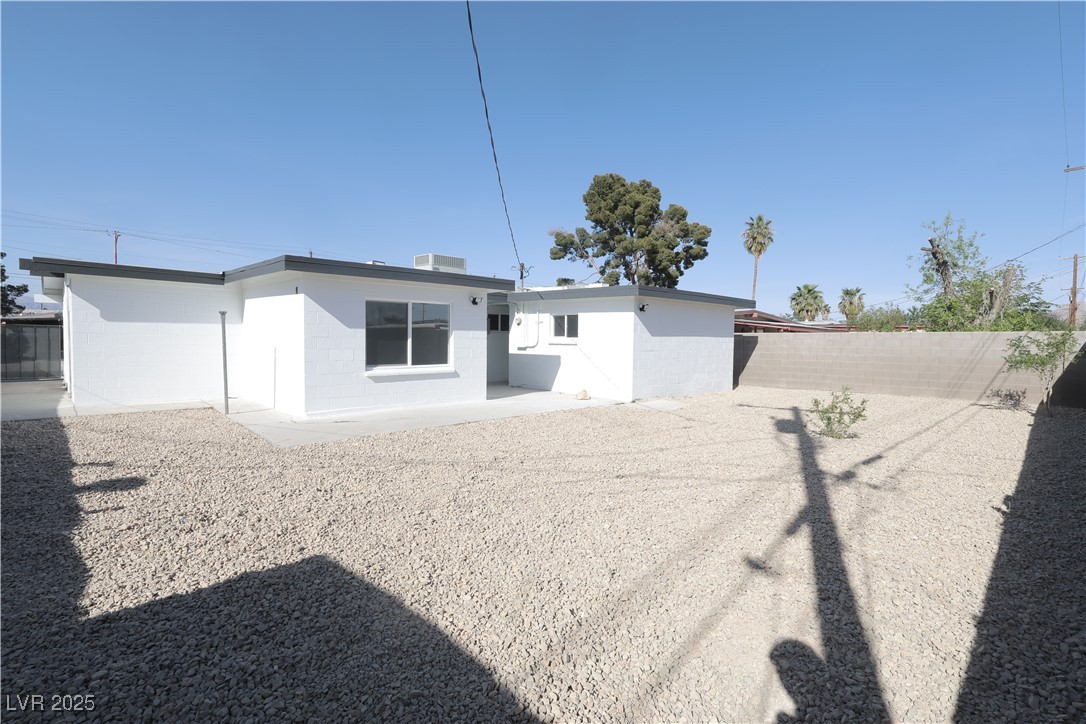 3115 Wright Avenue North Las Vegas, NV 89030 - Photo 19 of 20 Back of house featuring a patio, a fenced backyard
