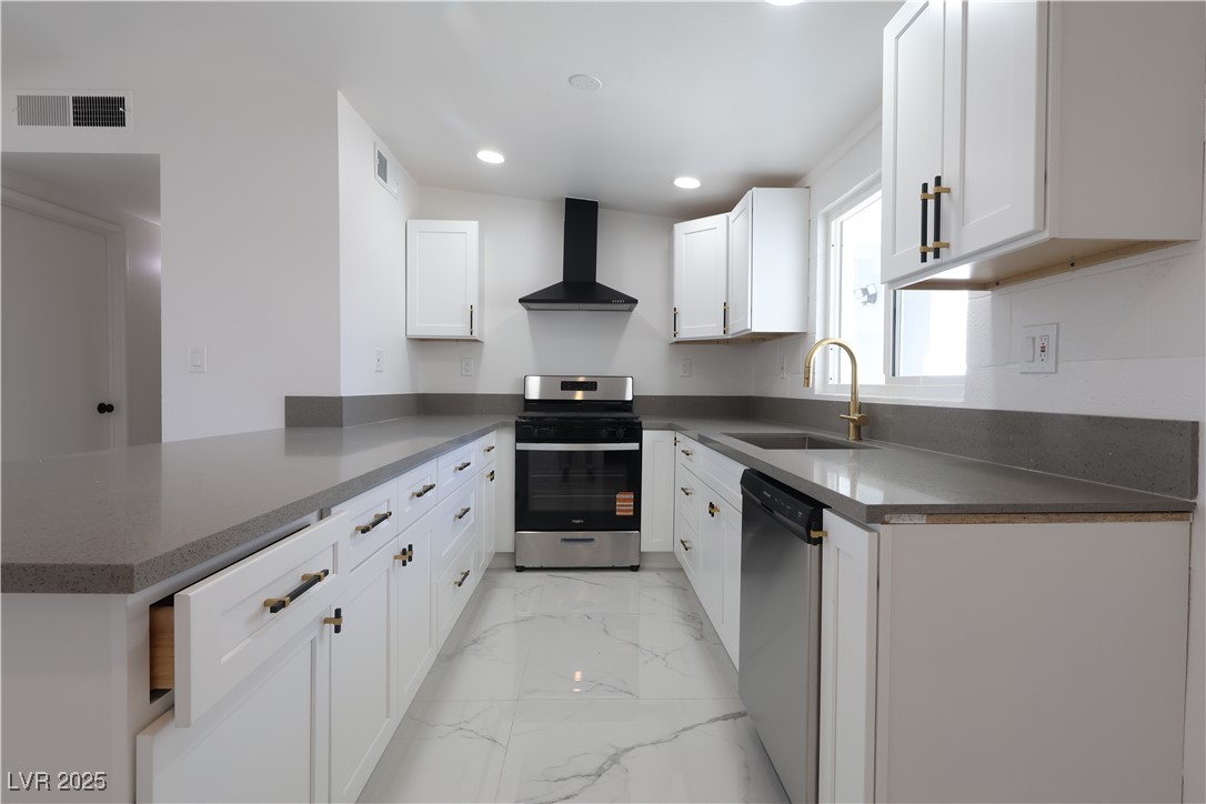 3115 Wright Avenue North Las Vegas, NV 89030 - Photo 2 of 20 Kitchen featuring visible vents, a sink, wall chim