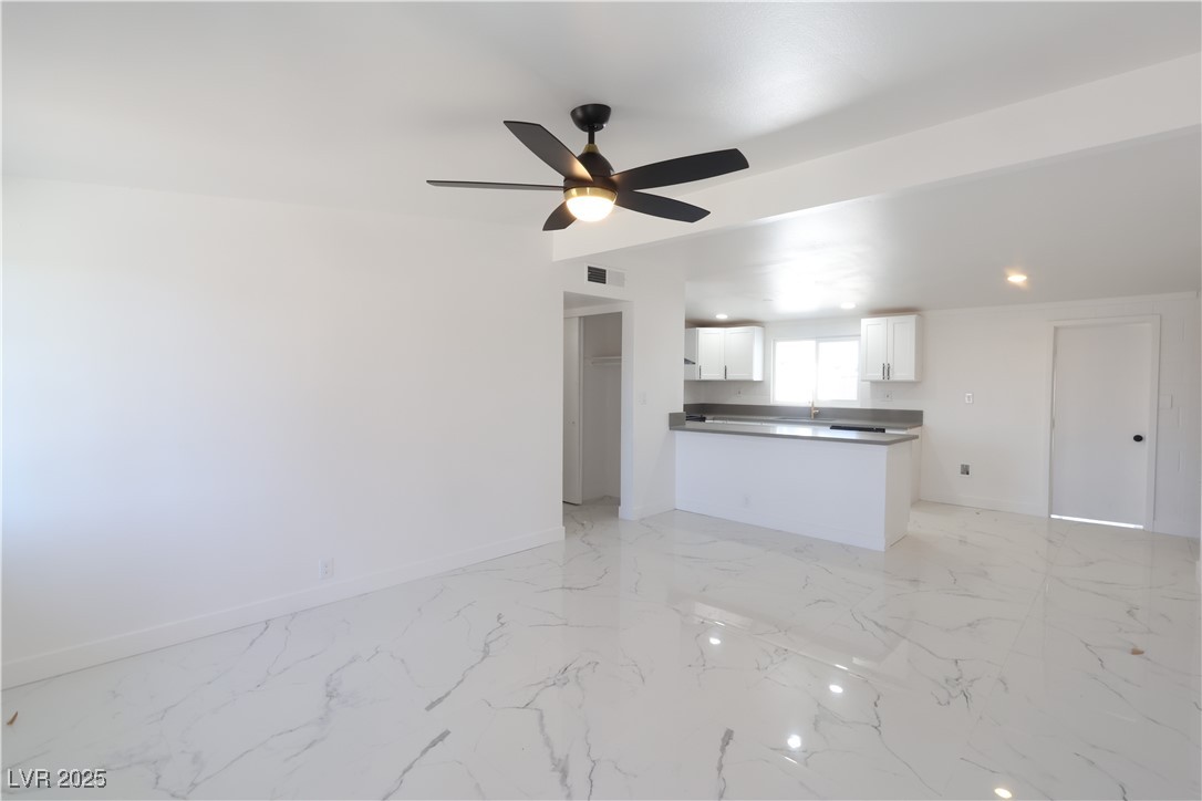 3115 Wright Avenue North Las Vegas, NV 89030 - Photo 3 of 20 Unfurnished living room featuring marble finish fl