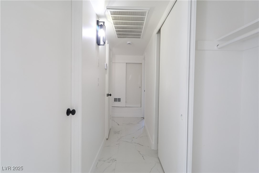 3115 Wright Avenue North Las Vegas, NV 89030 - Photo 5 of 20 Corridor with visible vents, baseboards, and marbl