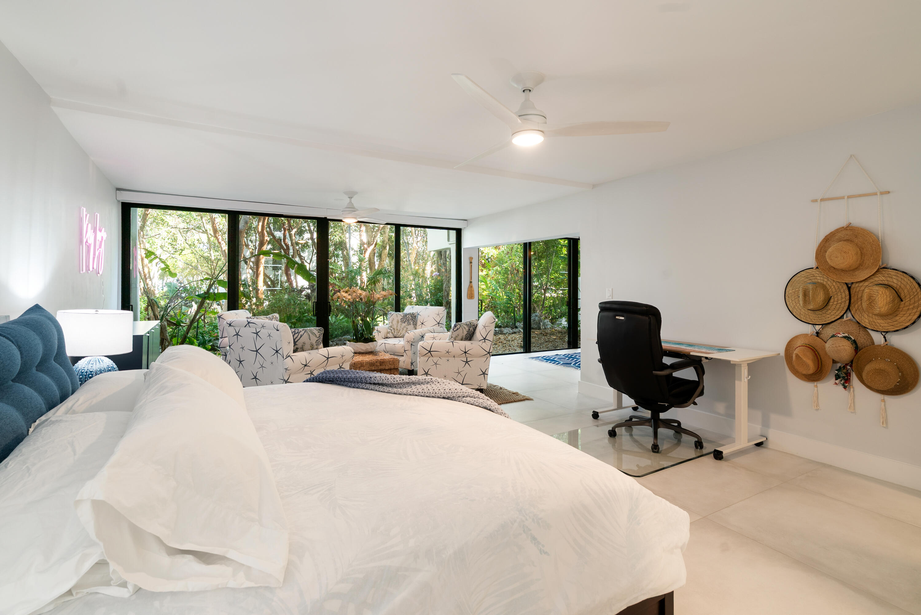 97652 Overseas Highway, Unit M4 Key Largo, FL 33037 - Photo 15 of 44 a large white bed sitting in a room next to a window