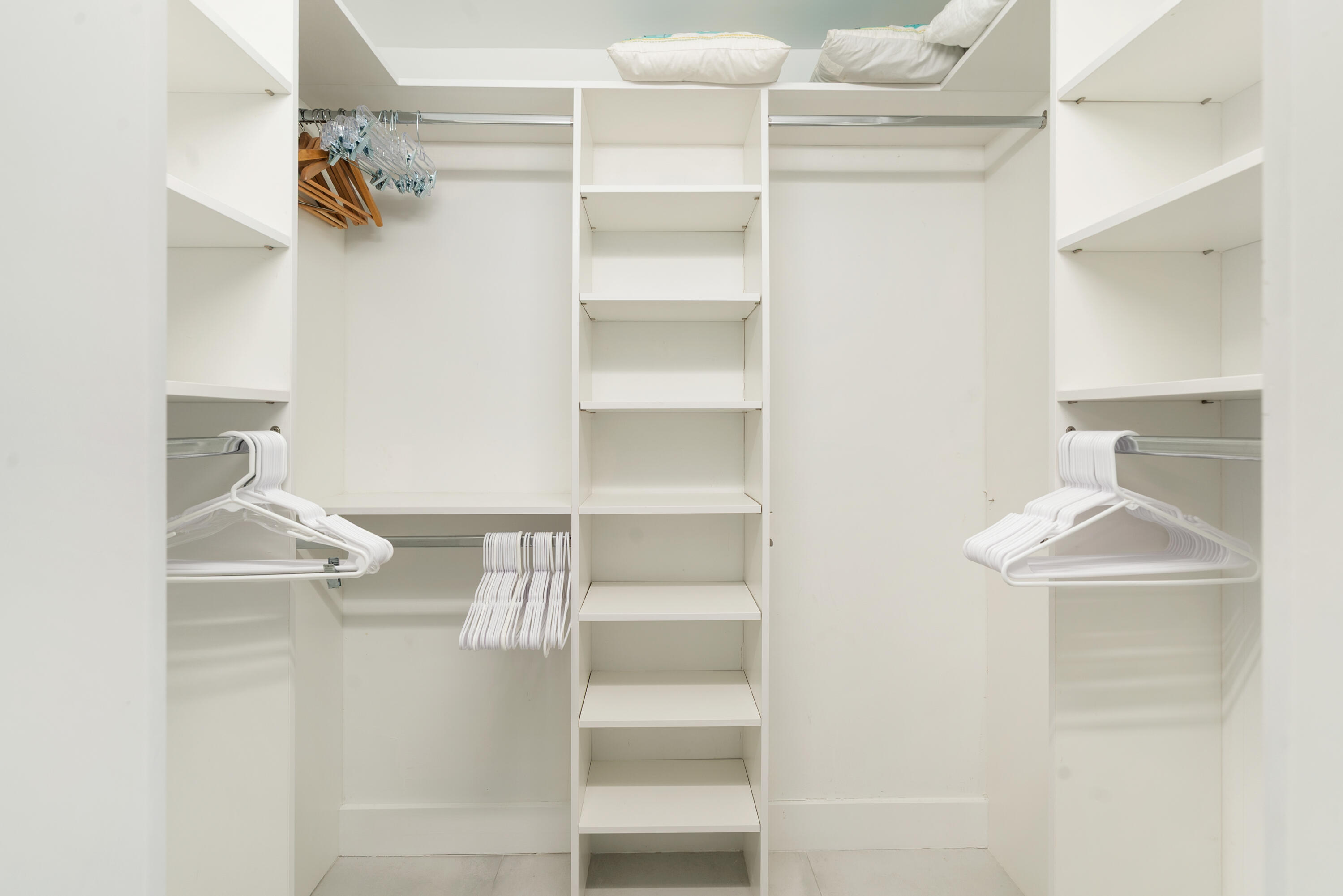 97652 Overseas Highway, Unit M4 Key Largo, FL 33037 - Photo 18 of 44 a view of walk in closet with empty racks