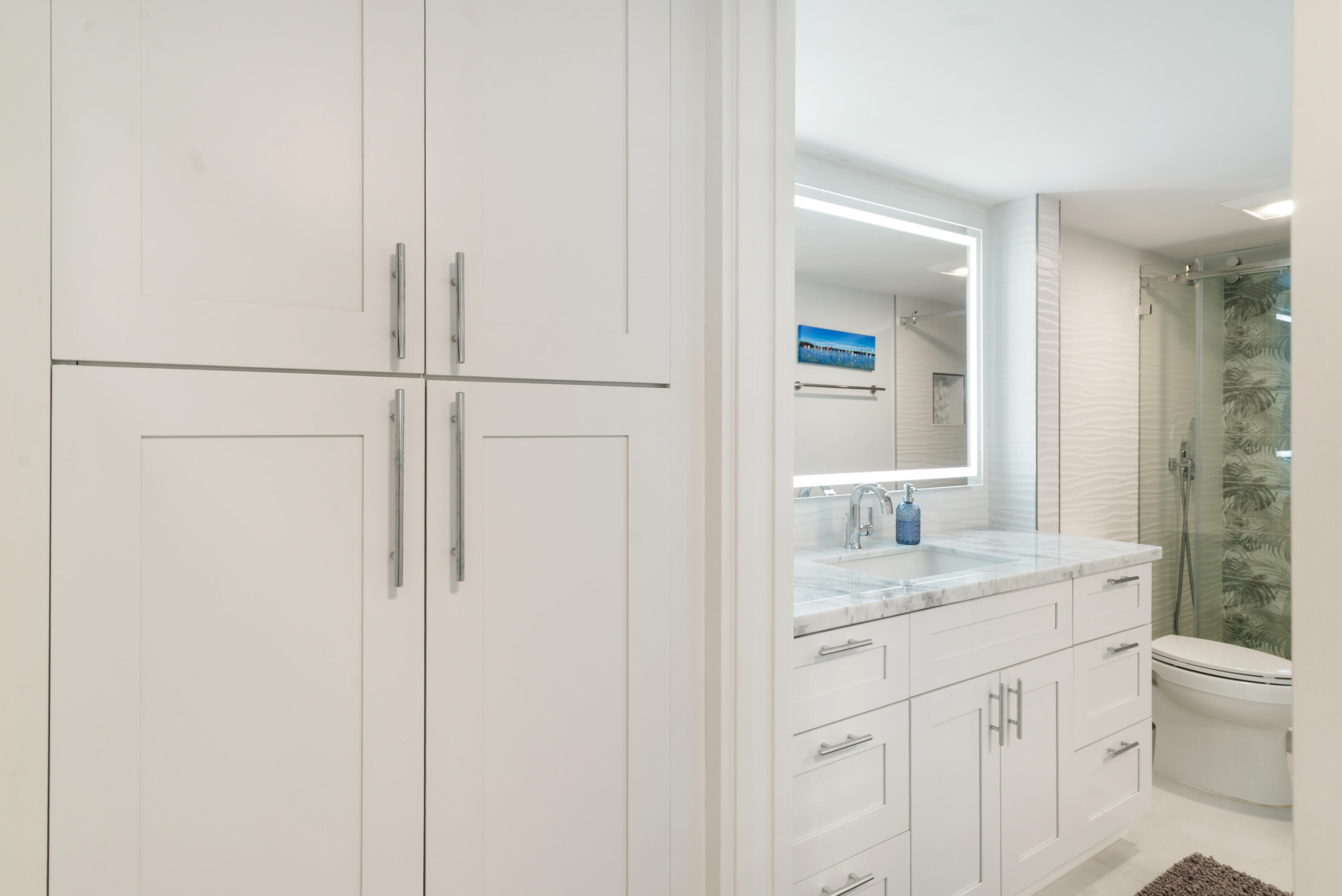 97652 Overseas Highway, Unit M4 Key Largo, FL 33037 - Photo 20 of 44 a bathroom with a granite countertop sink and a mirror