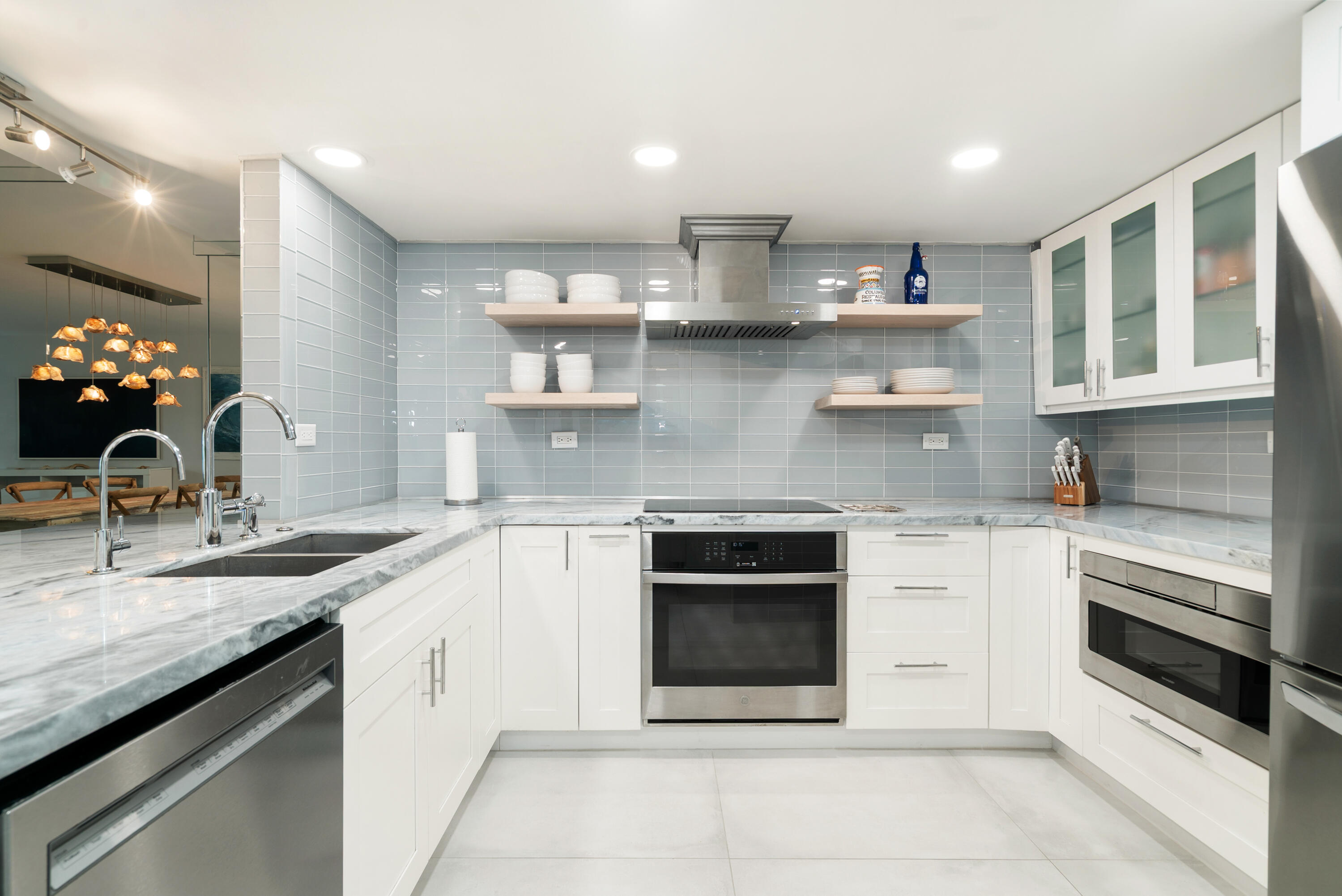 97652 Overseas Highway, Unit M4 Key Largo, FL 33037 - Photo 2 of 44 a kitchen with stainless steel appliances granite countertop a stove sink and cabinets