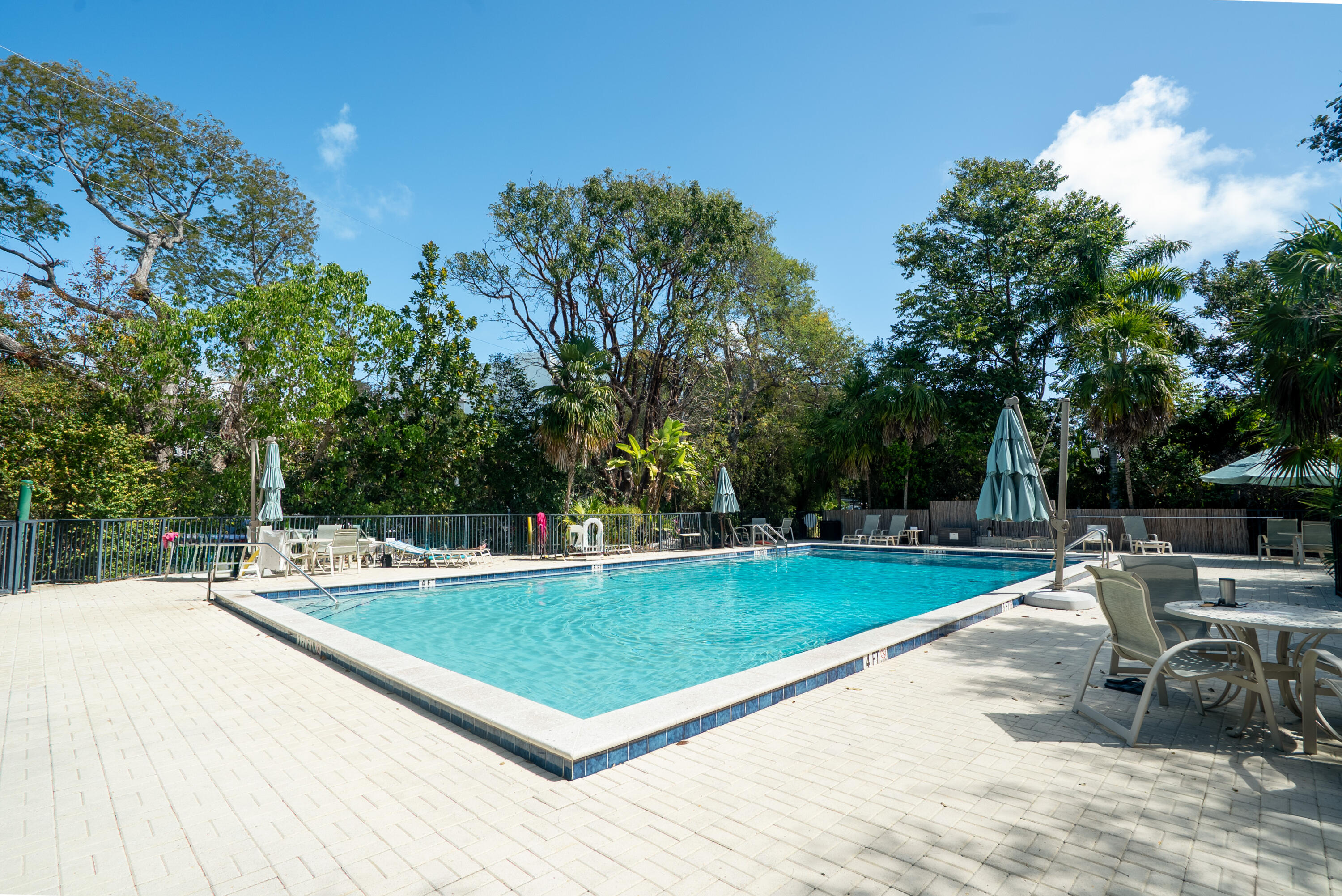 97652 Overseas Highway, Unit M4 Key Largo, FL 33037 - Photo 25 of 44 a view of a swimming pool with a patio