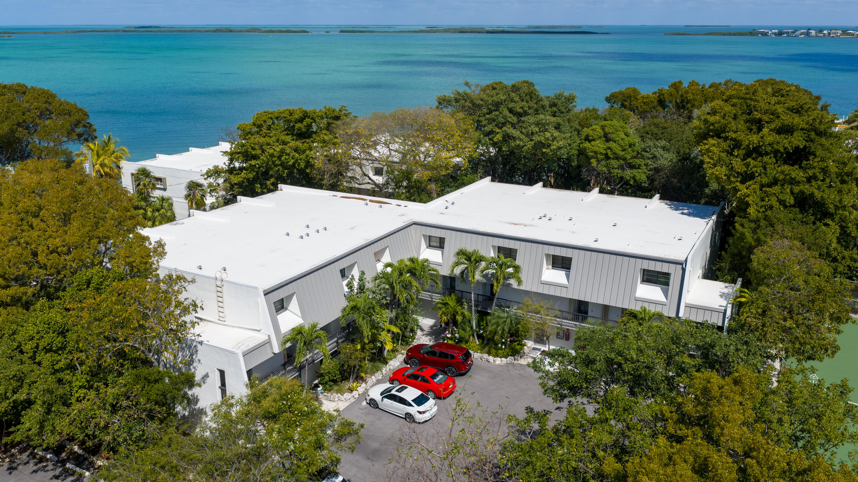 97652 Overseas Highway, Unit M4 Key Largo, FL 33037 - Photo 28 of 44 a aerial view of a house with a garden