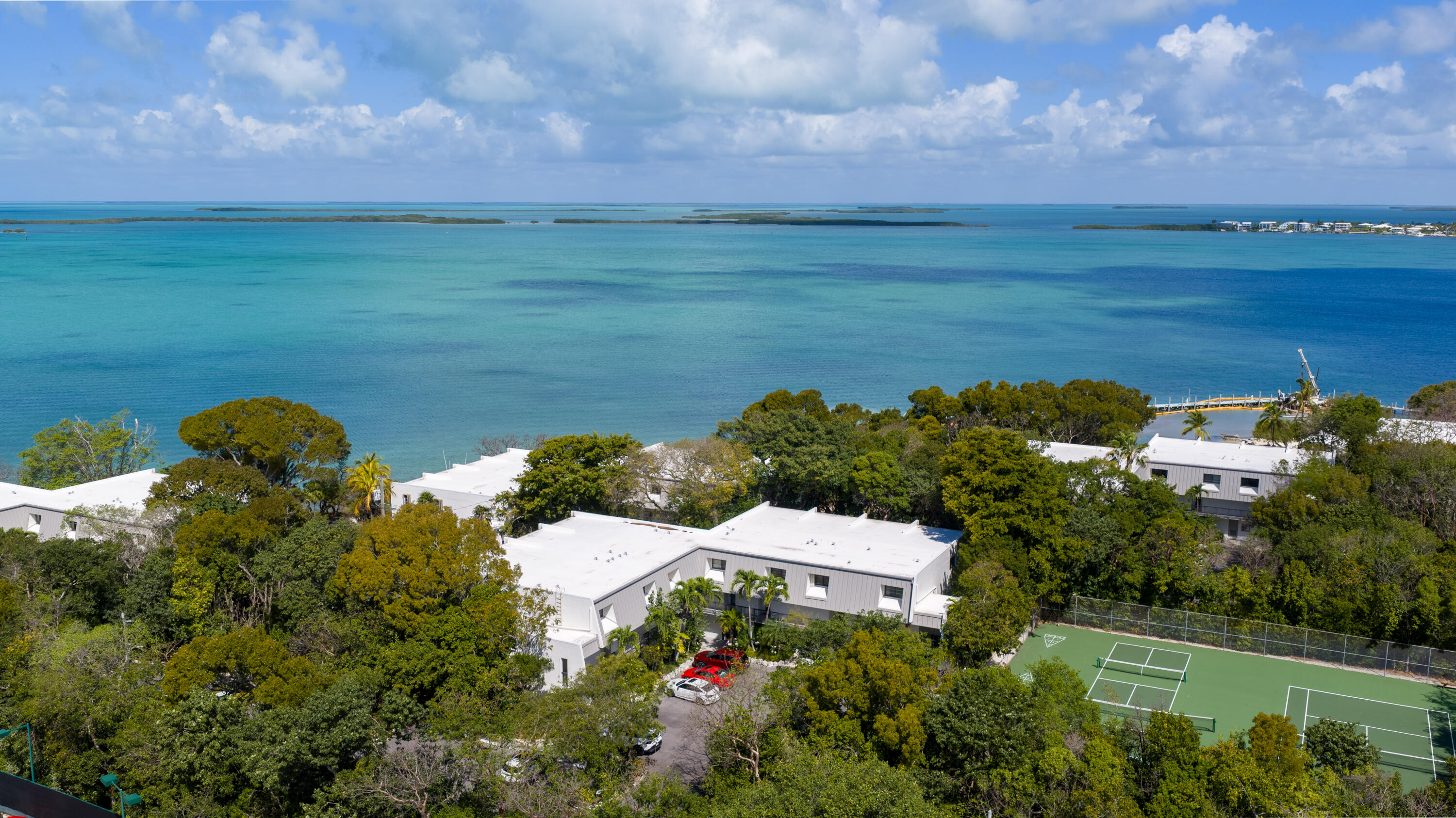 97652 Overseas Highway, Unit M4 Key Largo, FL 33037 - Photo 29 of 44 an aerial view of a house with a yard