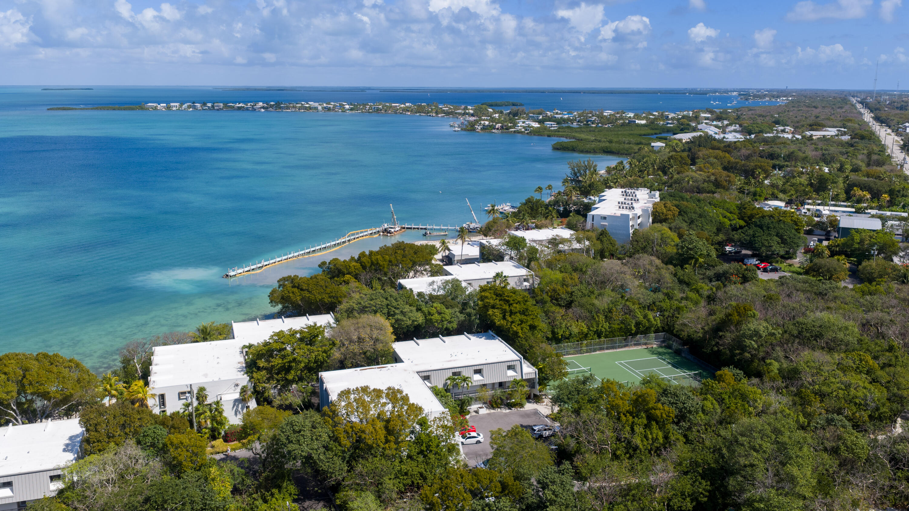 97652 Overseas Highway, Unit M4 Key Largo, FL 33037 - Photo 31 of 44 an aerial view of ocean with residential house with outdoor space
