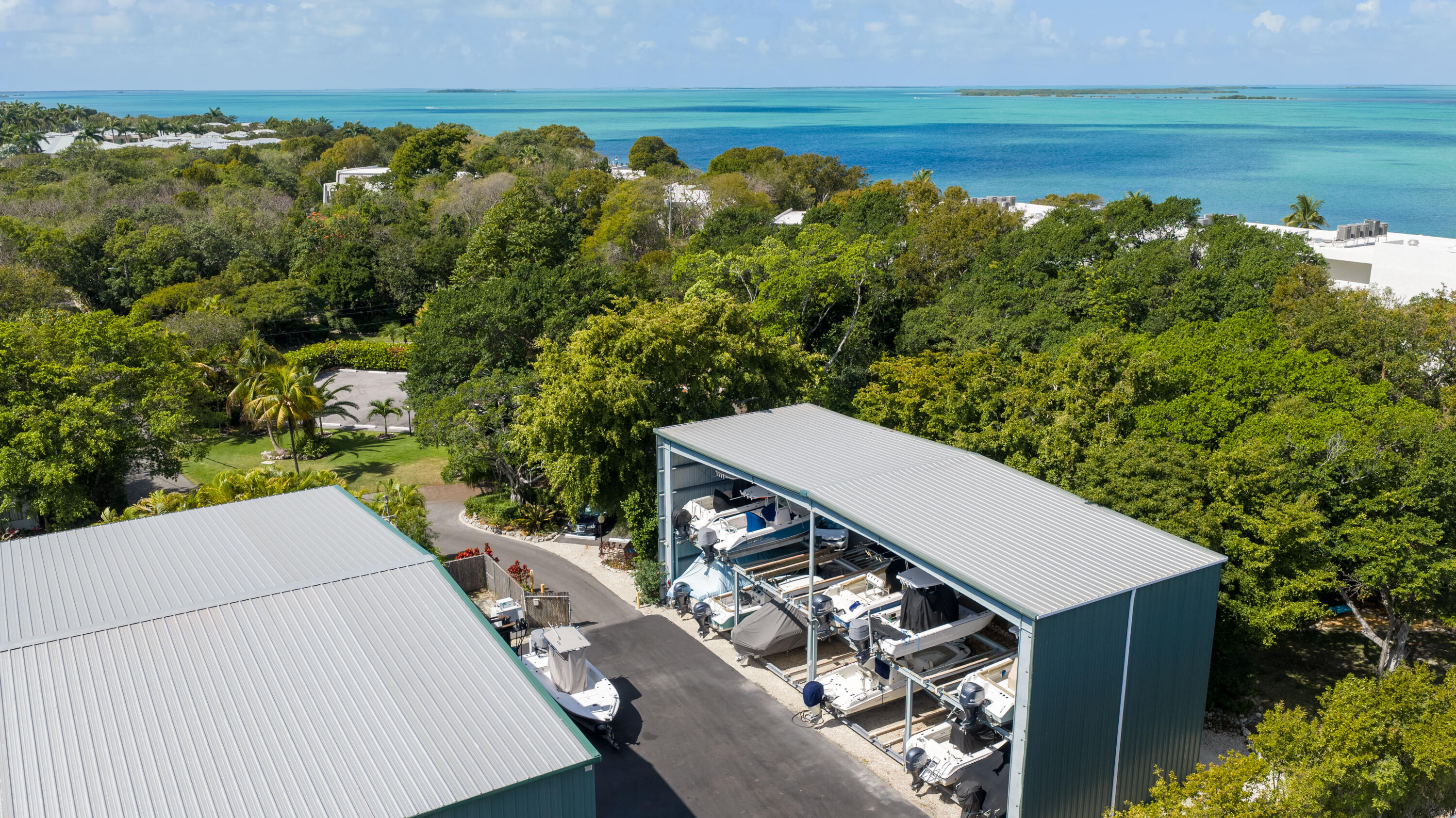 97652 Overseas Highway, Unit M4 Key Largo, FL 33037 - Photo 32 of 44 a view of a balcony with two chairs and a table