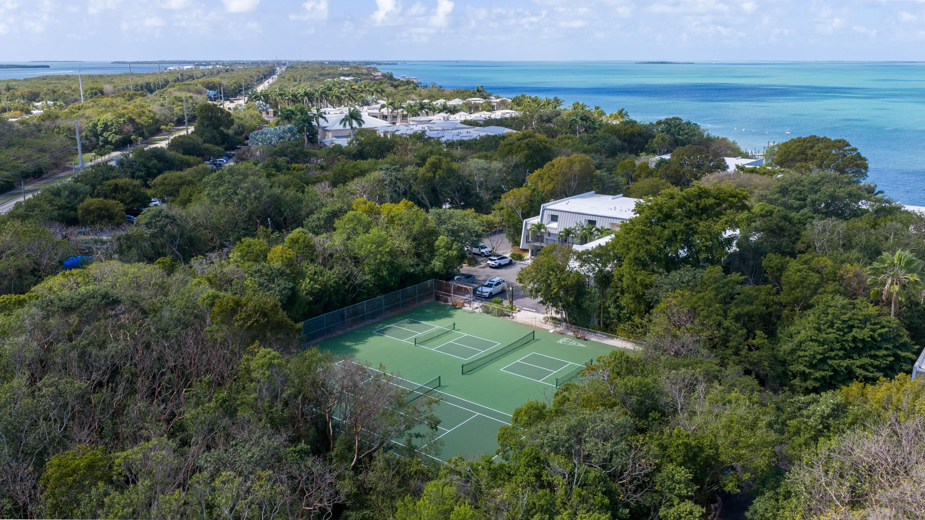 97652 Overseas Highway, Unit M4 Key Largo, FL 33037 - Photo 35 of 44 an aerial view of a residential houses with outdoor space and trees all around