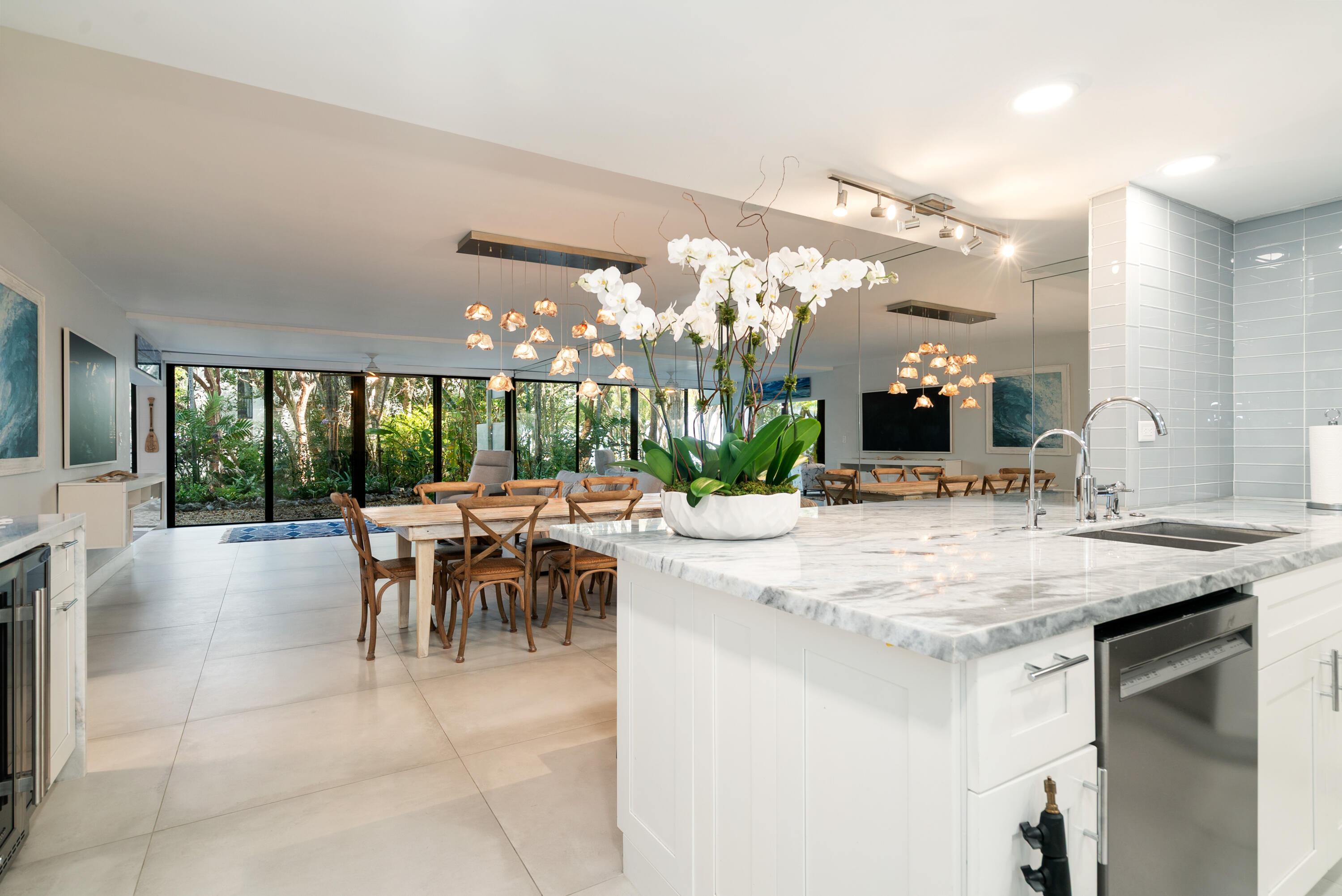 97652 Overseas Highway, Unit M4 Key Largo, FL 33037 - Photo 5 of 44 a kitchen with a table and chairs