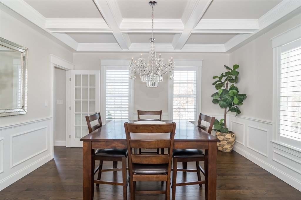 6 Hickory Road Natick, MA 01760 - Photo 12 of 35 a dining room with furniture a chandelier and wooden floor