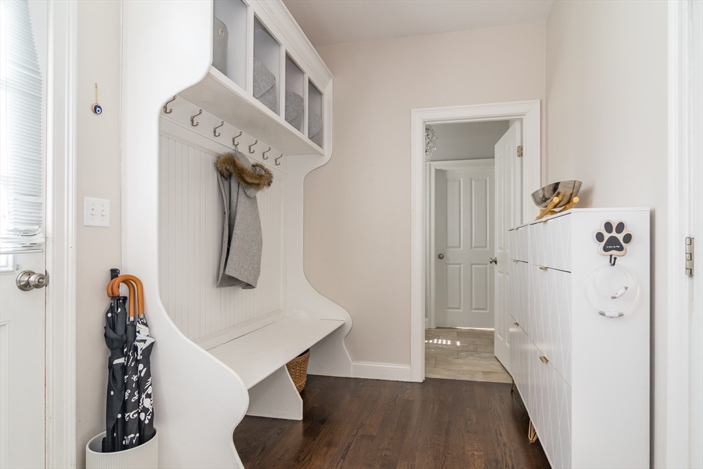 6 Hickory Road Natick, MA 01760 - Photo 13 of 35 a view of a hallway with entryway wooden floor and front door