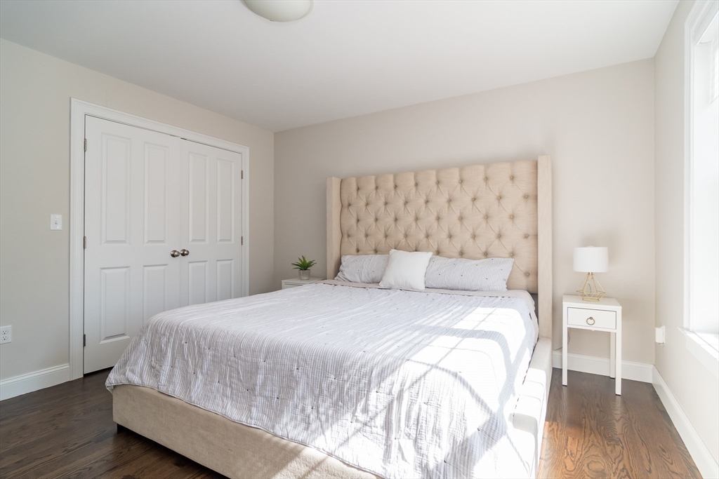 6 Hickory Road Natick, MA 01760 - Photo 16 of 35 a bedroom with a bed and wooden floor