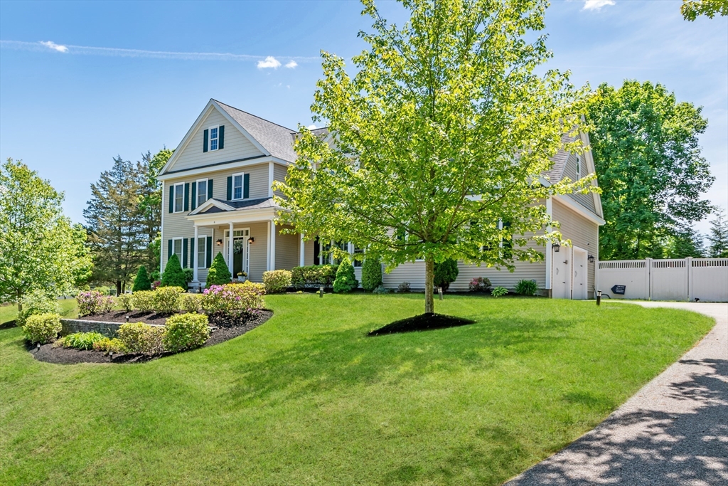 6 Hickory Road Natick, MA 01760 - Photo 2 of 35 a front view of a house with a yard