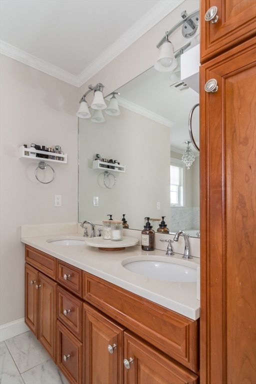 6 Hickory Road Natick, MA 01760 - Photo 23 of 35 a bathroom with a sink double vanity and a mirror