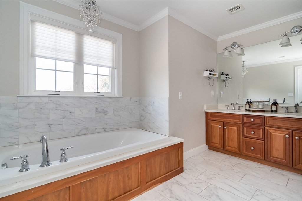 6 Hickory Road Natick, MA 01760 - Photo 24 of 35 a spacious bathroom with a tub sink and mirror