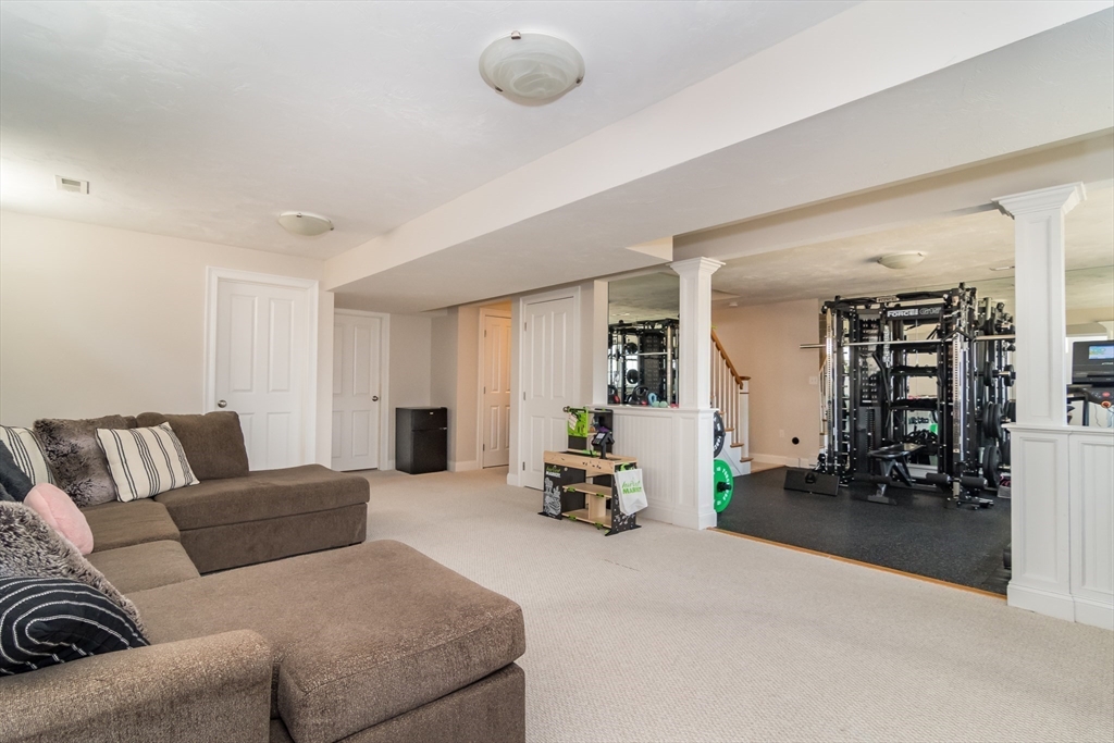 6 Hickory Road Natick, MA 01760 - Photo 26 of 35 a living room with furniture and flowers