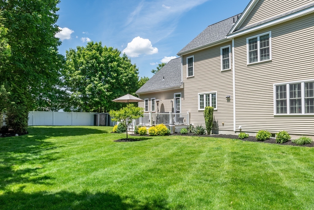 6 Hickory Road Natick, MA 01760 - Photo 32 of 35 a view of a house with a yard and sitting area