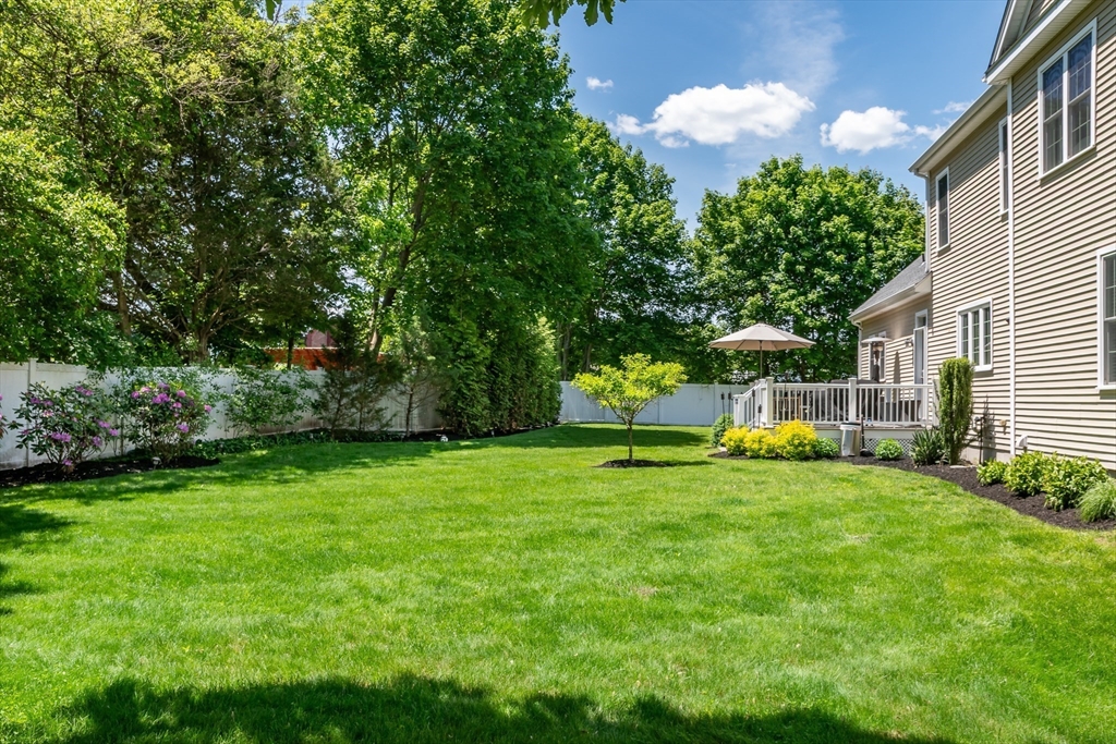 6 Hickory Road Natick, MA 01760 - Photo 33 of 35 a view of a backyard with a garden