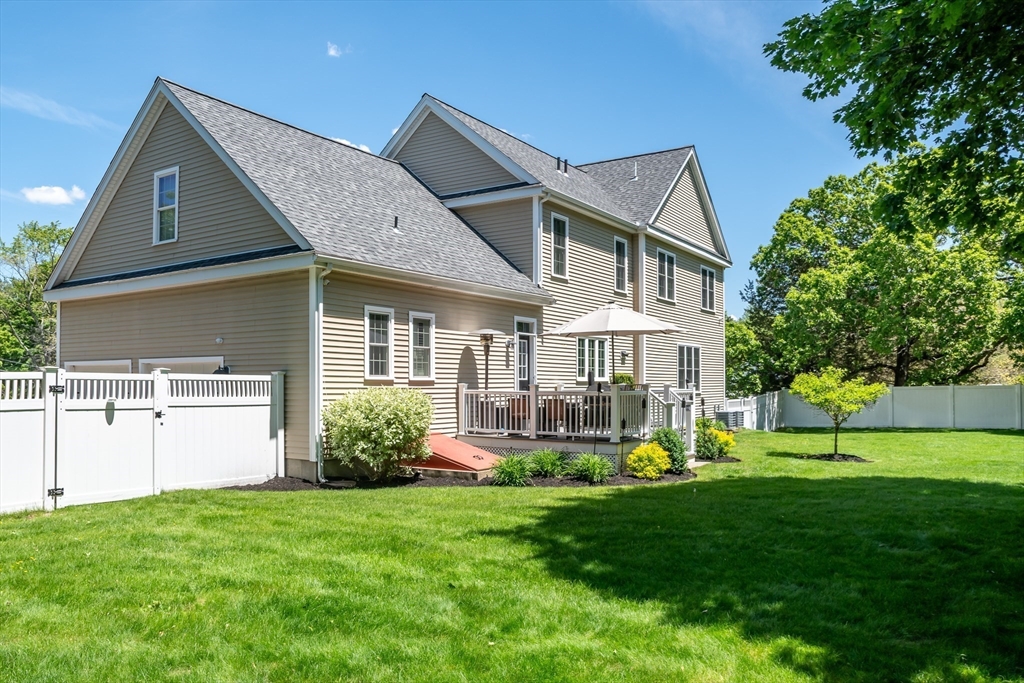 6 Hickory Road Natick, MA 01760 - Photo 34 of 35 a front view of a house with garden and trees