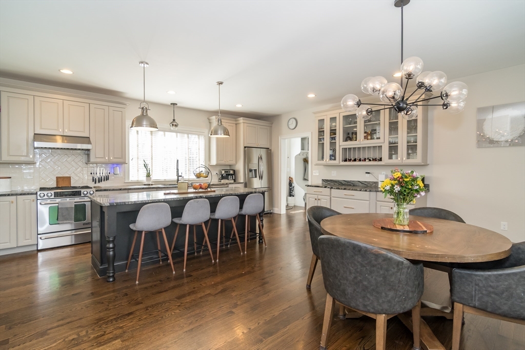 6 Hickory Road Natick, MA 01760 - Photo 6 of 35 a view of a dining room with furniture a chandelier and wooden floor